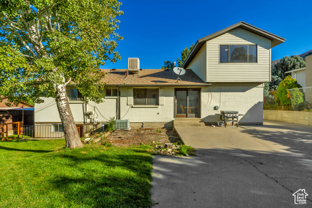 360 East Center Street Centerville, UT 84014 - Photo 7 of 41 Rear view of property with brick siding and roof with shingles