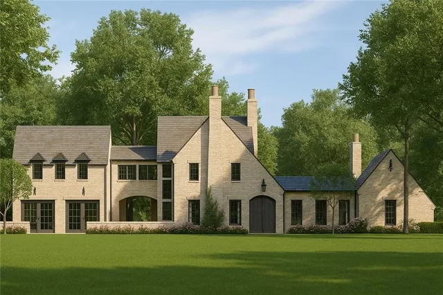 a front view of building with yard and green space