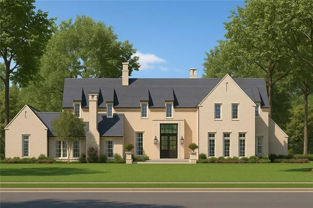 a front view of residential houses with yard and car parked