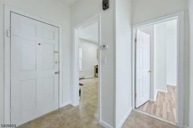 a view of a bathroom from a hallway