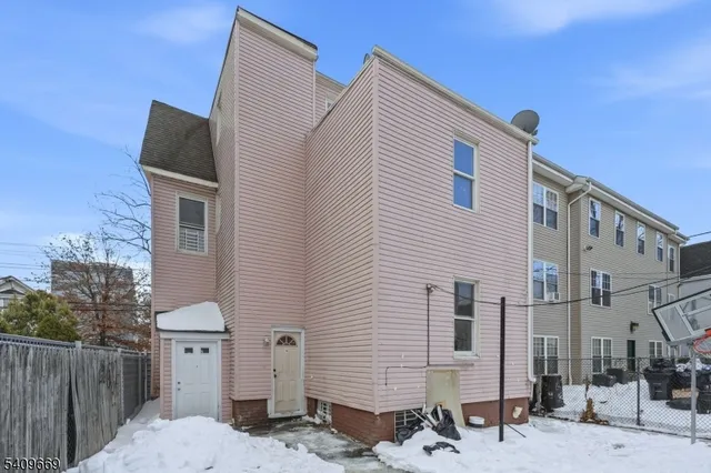 a front view of a house with many windows