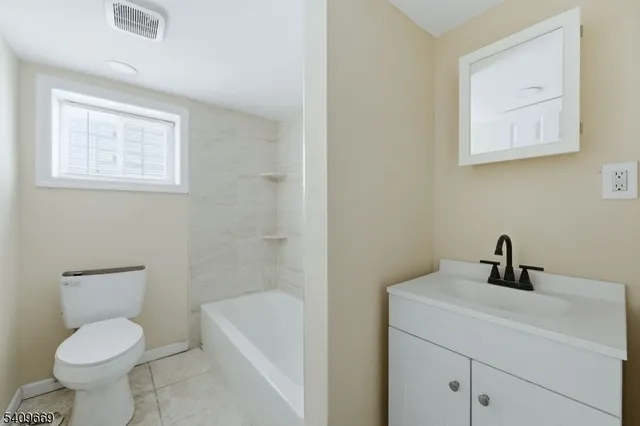 a bathroom with a toilet sink and bathtub