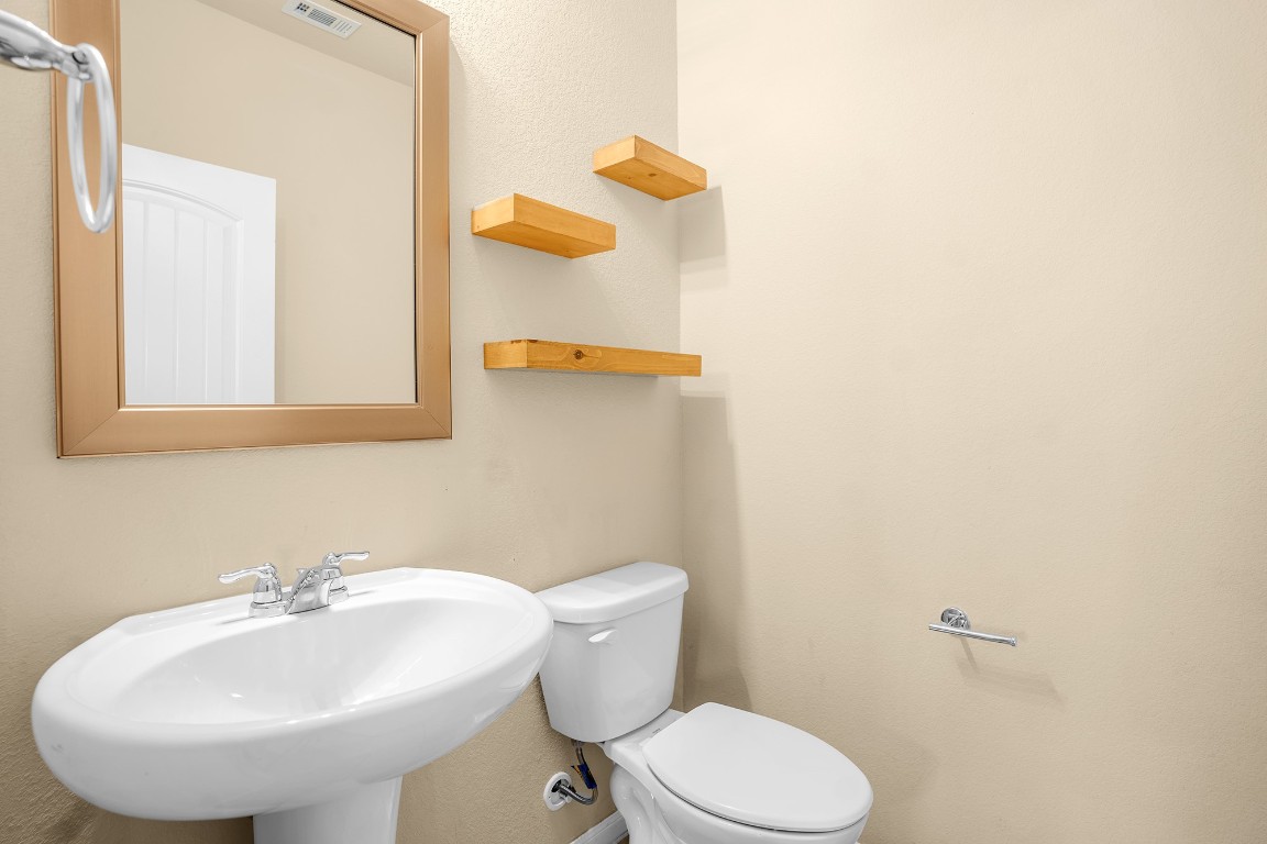 2880 Donnell Drive, Unit 2003 Round Rock, TX 78664 - Photo 11 of 27 a bathroom with a sink and a toilet