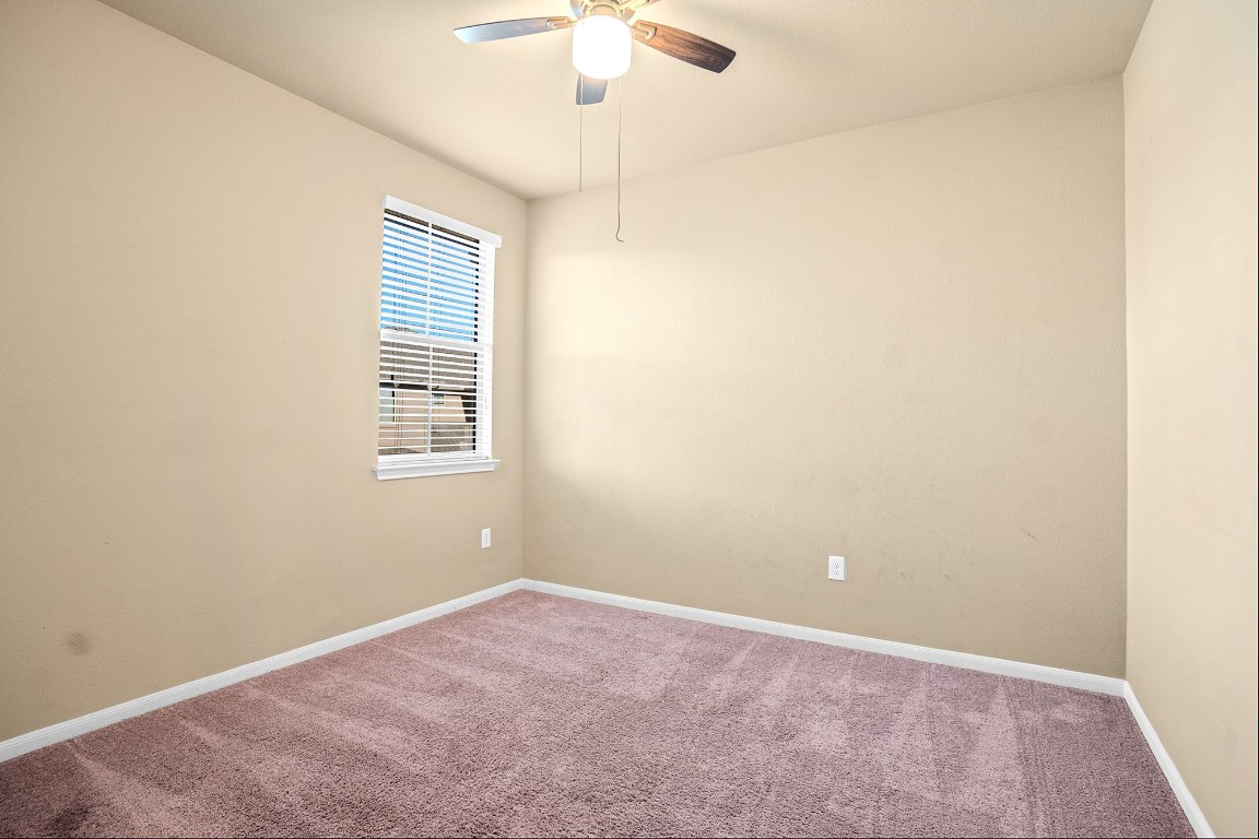 2880 Donnell Drive, Unit 2003 Round Rock, TX 78664 - Photo 15 of 27 an empty room with a window and a fan