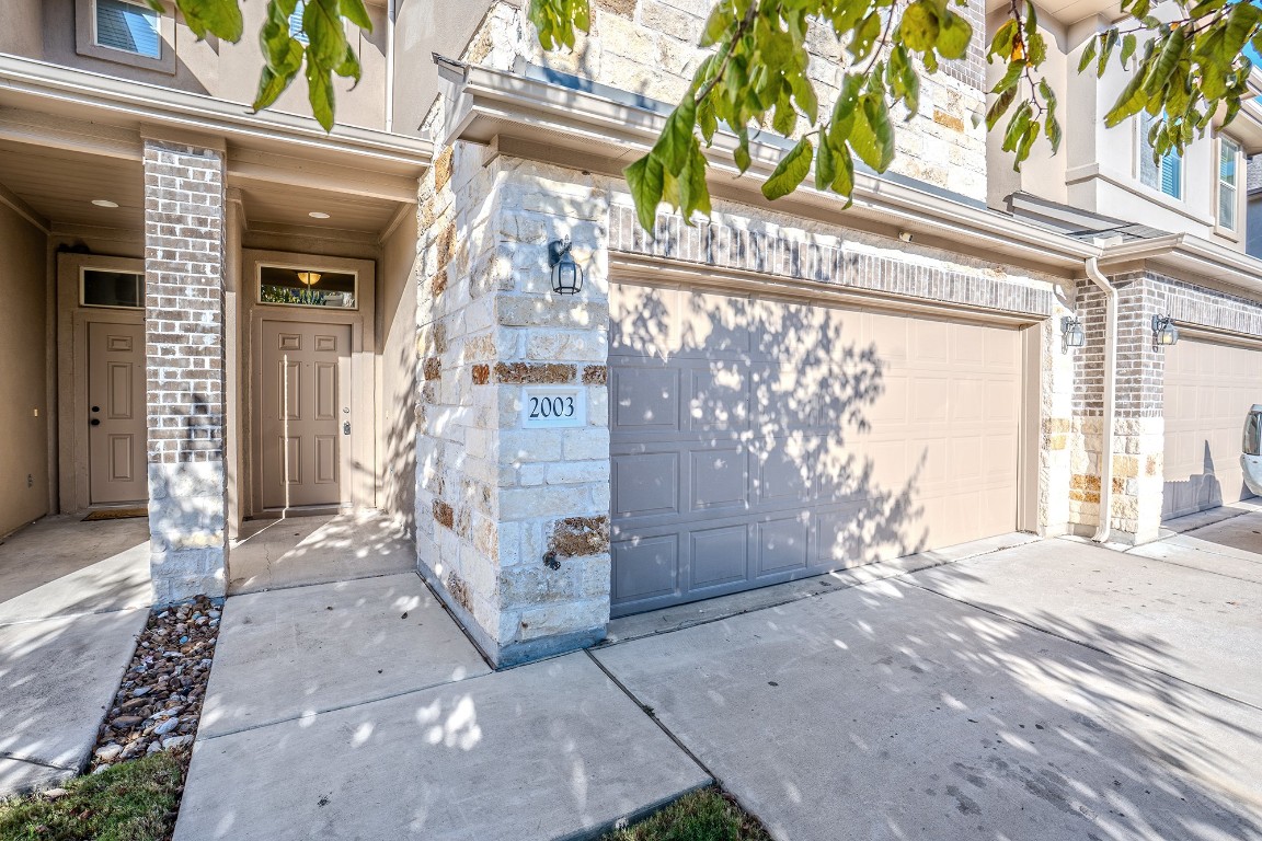 2880 Donnell Drive, Unit 2003 Round Rock, TX 78664 - Photo 3 of 27 a view of a entryway door of the house