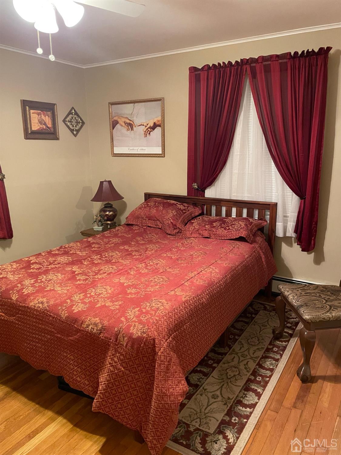 94 South Hill Road Colonia, NJ 07067 - Photo 9 of 15 a bedroom with a bed and a window