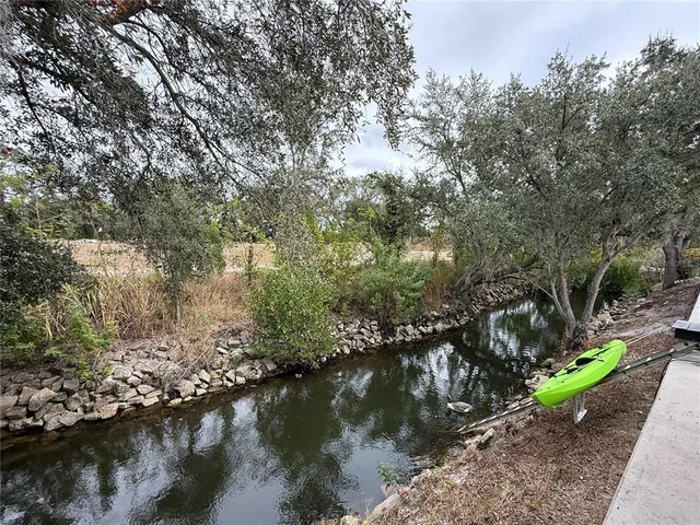 a view of lake with green space