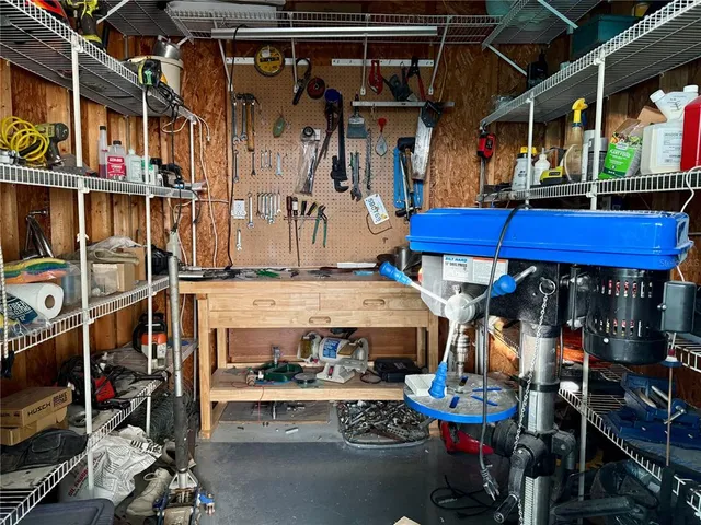 a view of a house with a yard and a garage