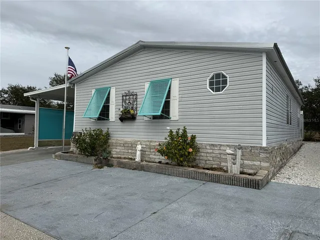 a sign on the side of the river