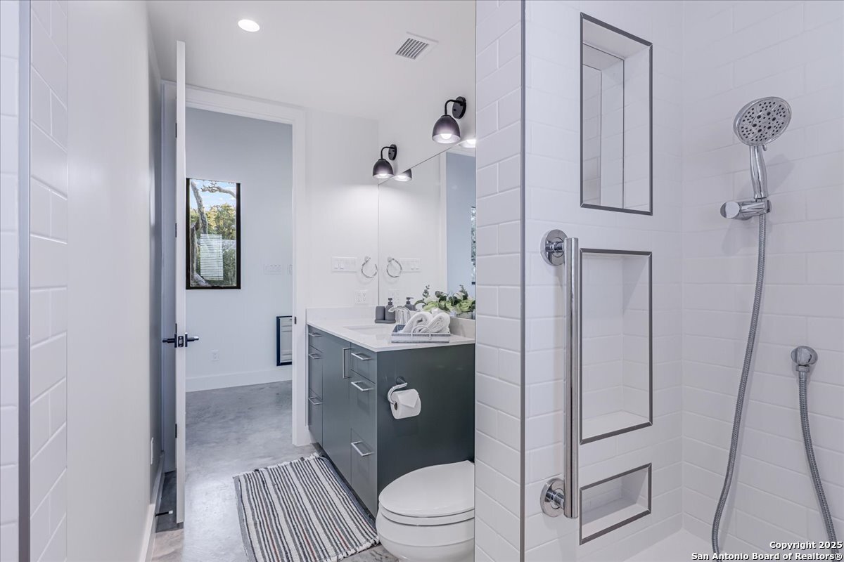 6031 Loop 1781 Rockport, TX 78382 - Photo 13 of 42 a bathroom with a sink a toilet and shower