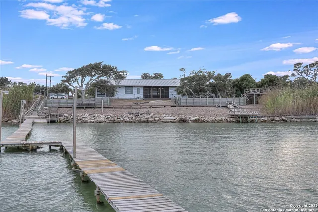 a balcony with table and chairs