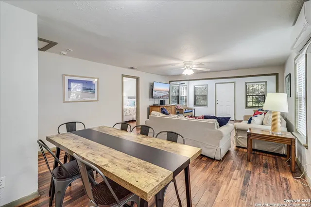 a dining room with furniture and window