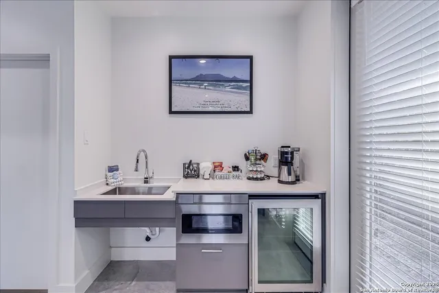 a view of a livingroom with furniture and staircase