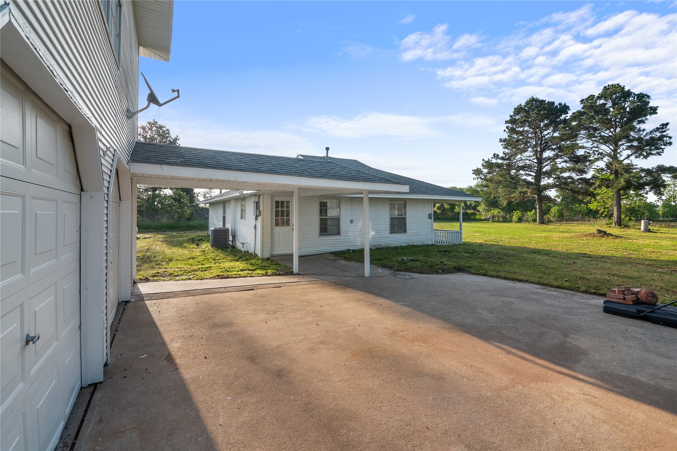 36622 Tompkins Road Hempstead, TX 77445 - Photo 15 of 46 a view of a house with a big yard and large tree