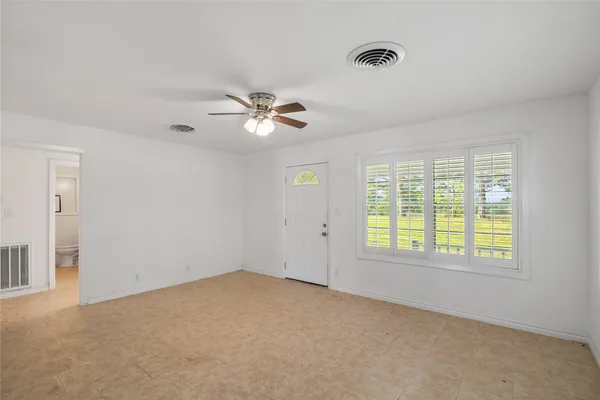 a view of a kitchen with wooden floor and a sink