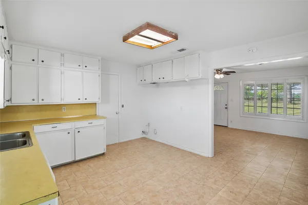 a bathroom with a toilet sink and shower