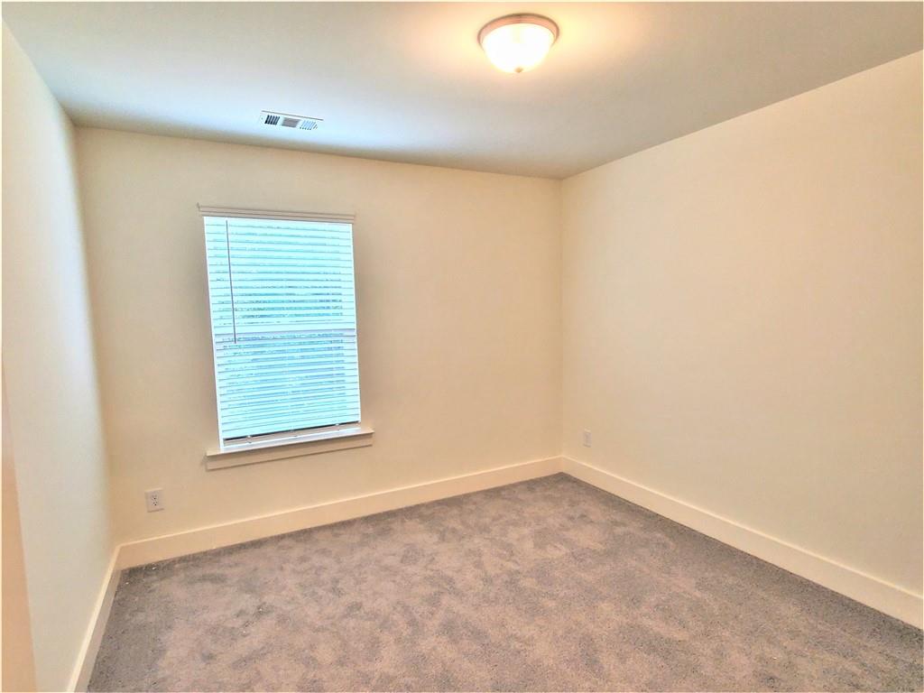 389 Auburn Valley Way Auburn, GA 30011 - Photo 11 of 29 an empty room with a window