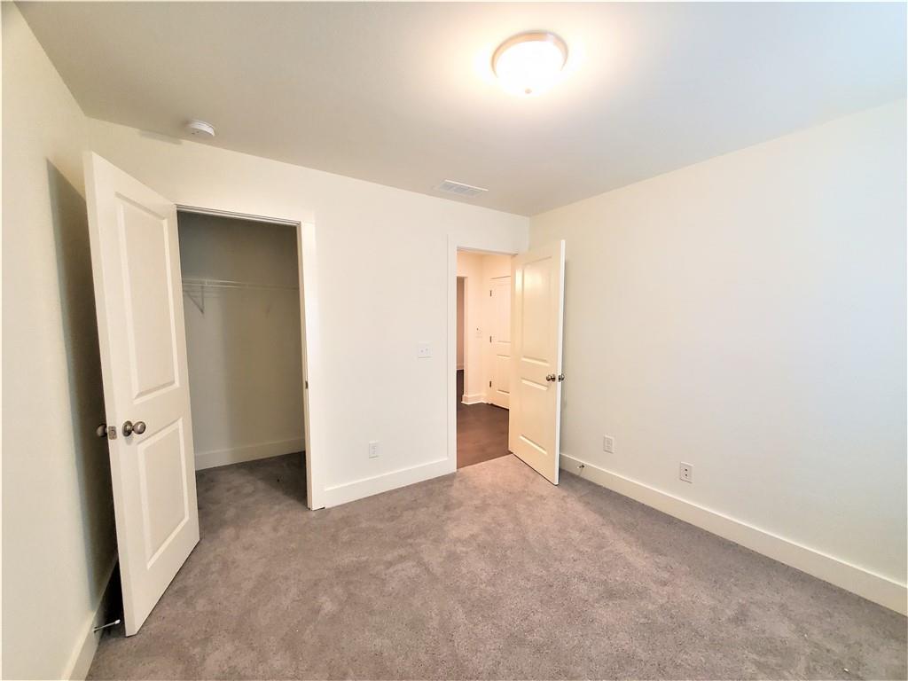 389 Auburn Valley Way Auburn, GA 30011 - Photo 12 of 29 an empty room with closet