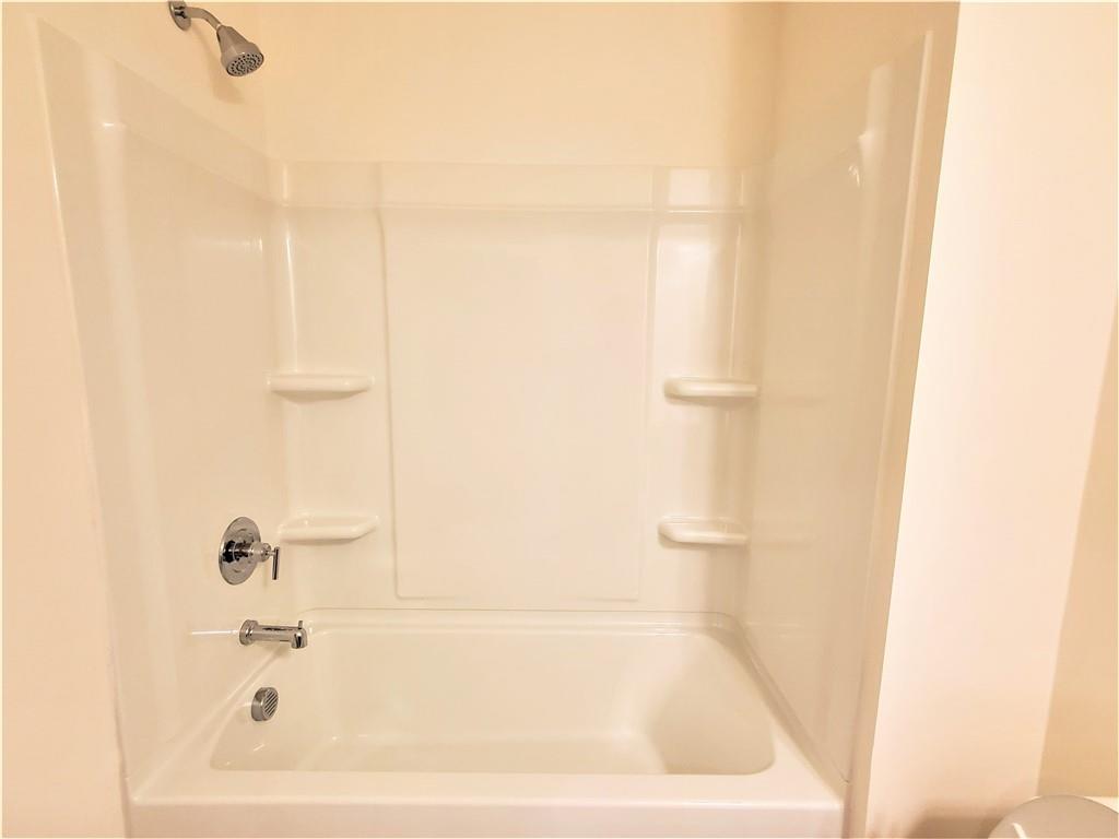 389 Auburn Valley Way Auburn, GA 30011 - Photo 15 of 29 a white bath tub sitting next to a white sink