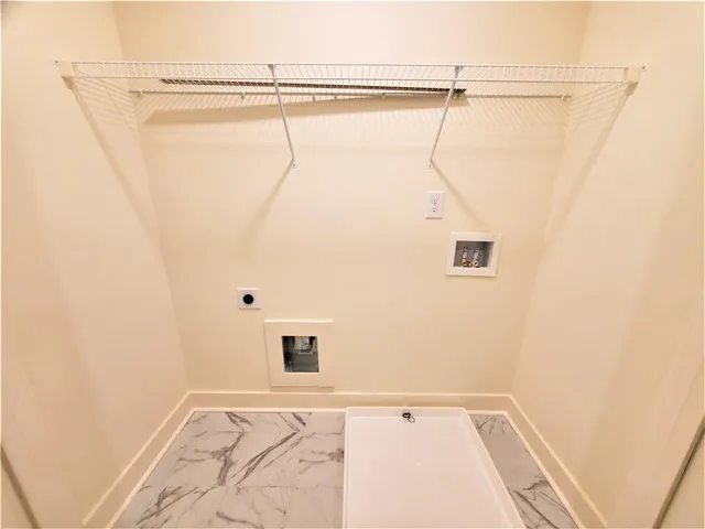 a bathroom with a shower and a shower head