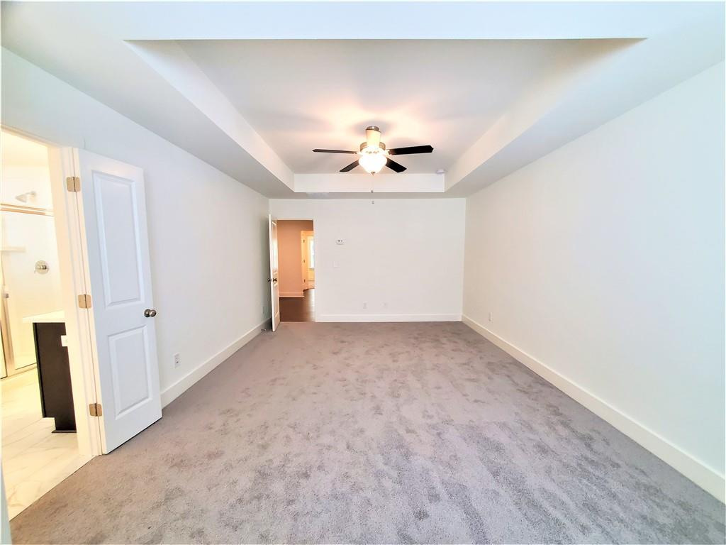 389 Auburn Valley Way Auburn, GA 30011 - Photo 23 of 29 a view of an empty room and chandelier fan