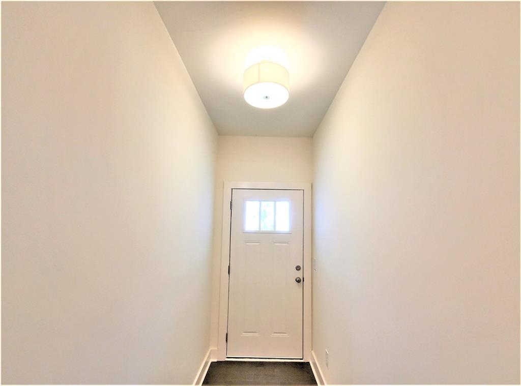 389 Auburn Valley Way Auburn, GA 30011 - Photo 3 of 29 a view of an entryway with wooden floor
