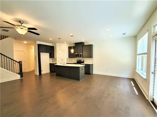 a view of a kitchen with a sink and a window