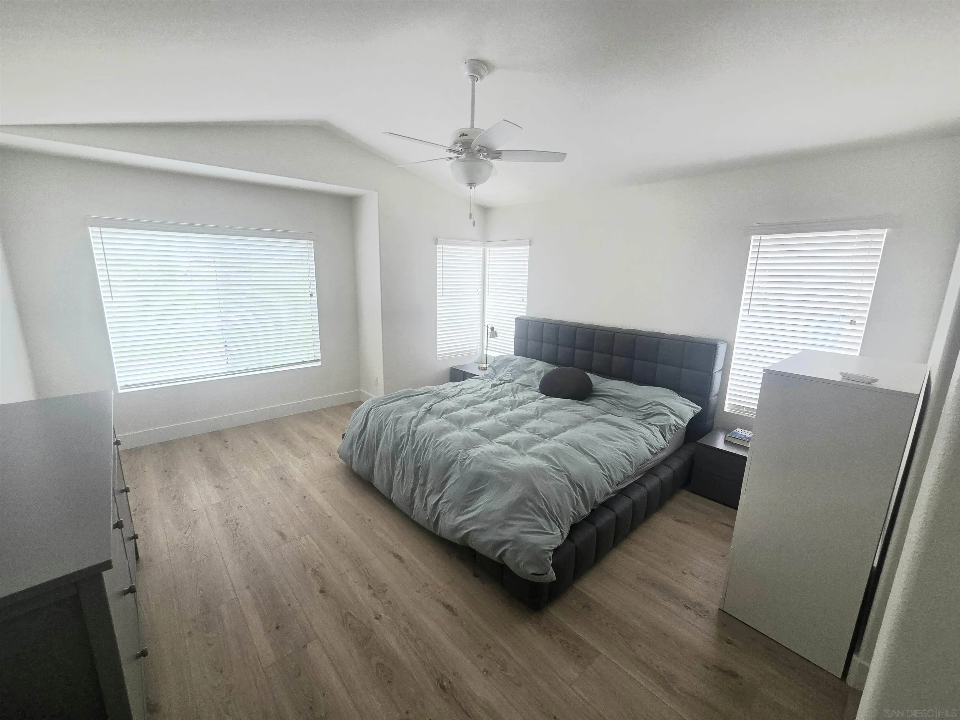 4802 Baroque Terrace Oceanside, CA 92057 - Photo 12 of 26 a bedroom with a bed and window