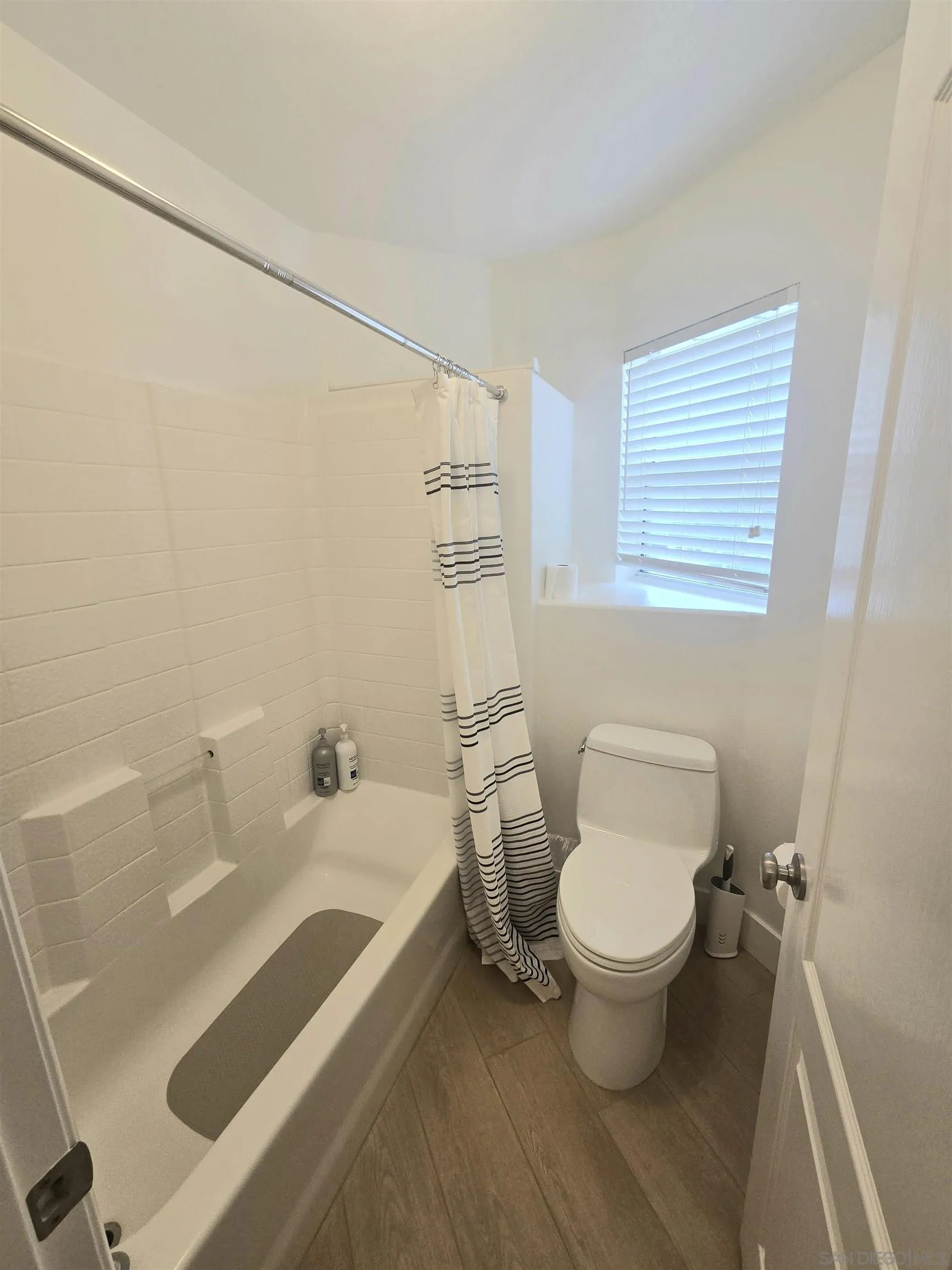4802 Baroque Terrace Oceanside, CA 92057 - Photo 17 of 26 a bathroom with a sink and a toilet