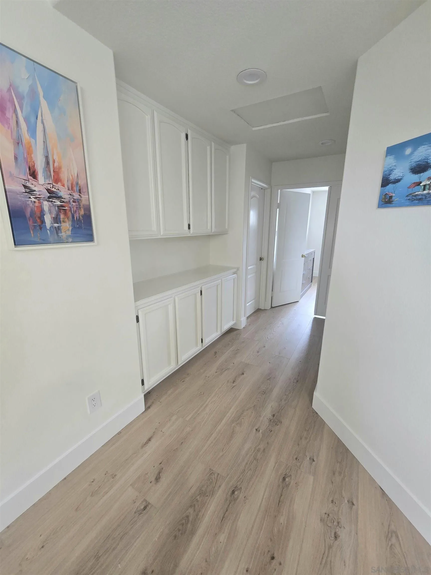 4802 Baroque Terrace Oceanside, CA 92057 - Photo 18 of 26 a view of a kitchen with wooden floor