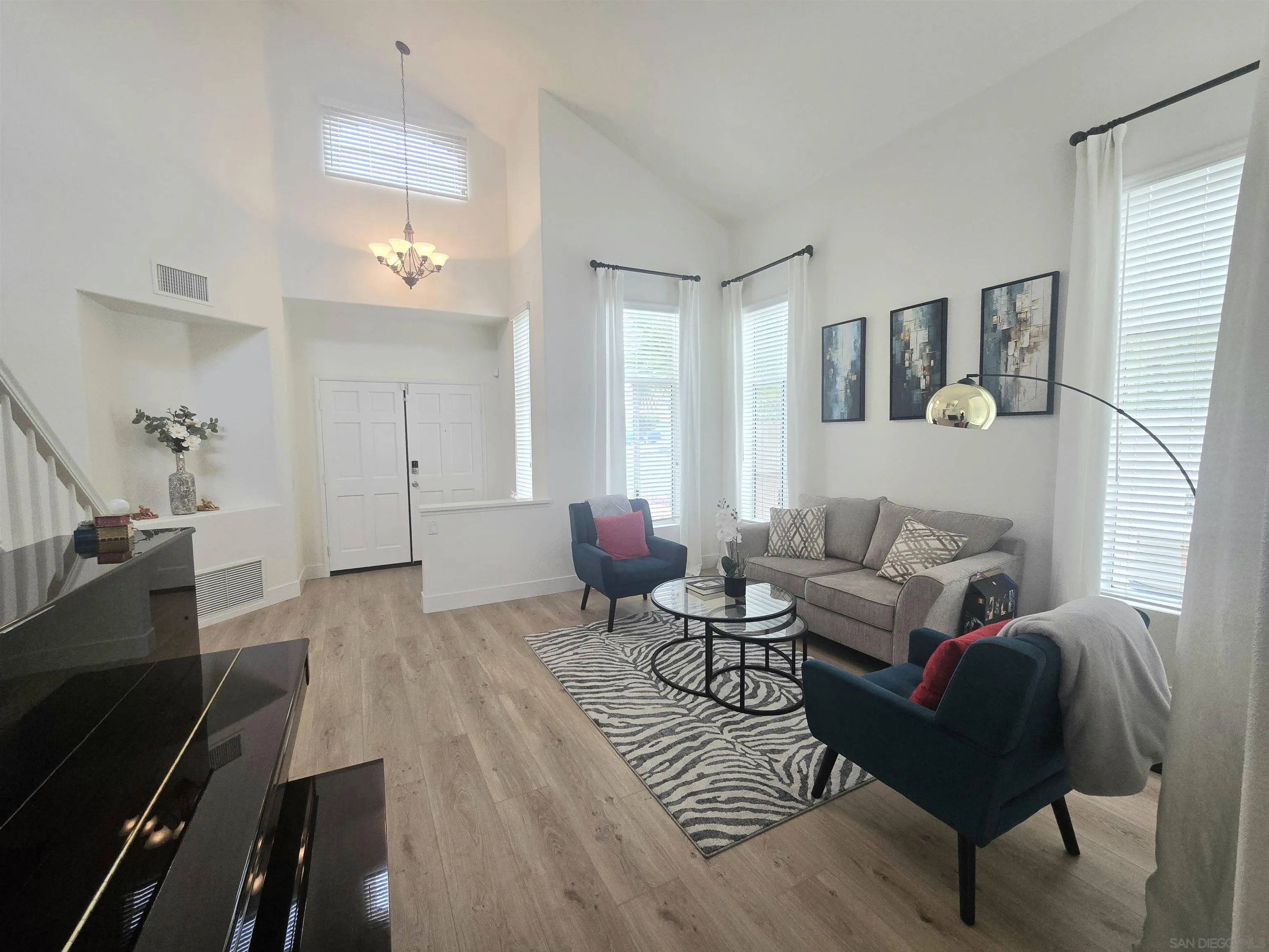 4802 Baroque Terrace Oceanside, CA 92057 - Photo 2 of 26 a living room with furniture and wooden floor
