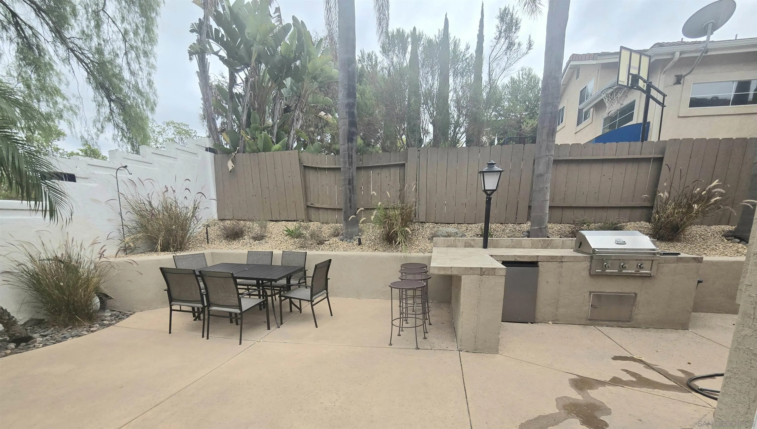 4802 Baroque Terrace Oceanside, CA 92057 - Photo 24 of 26 a view of a patio with table and chairs