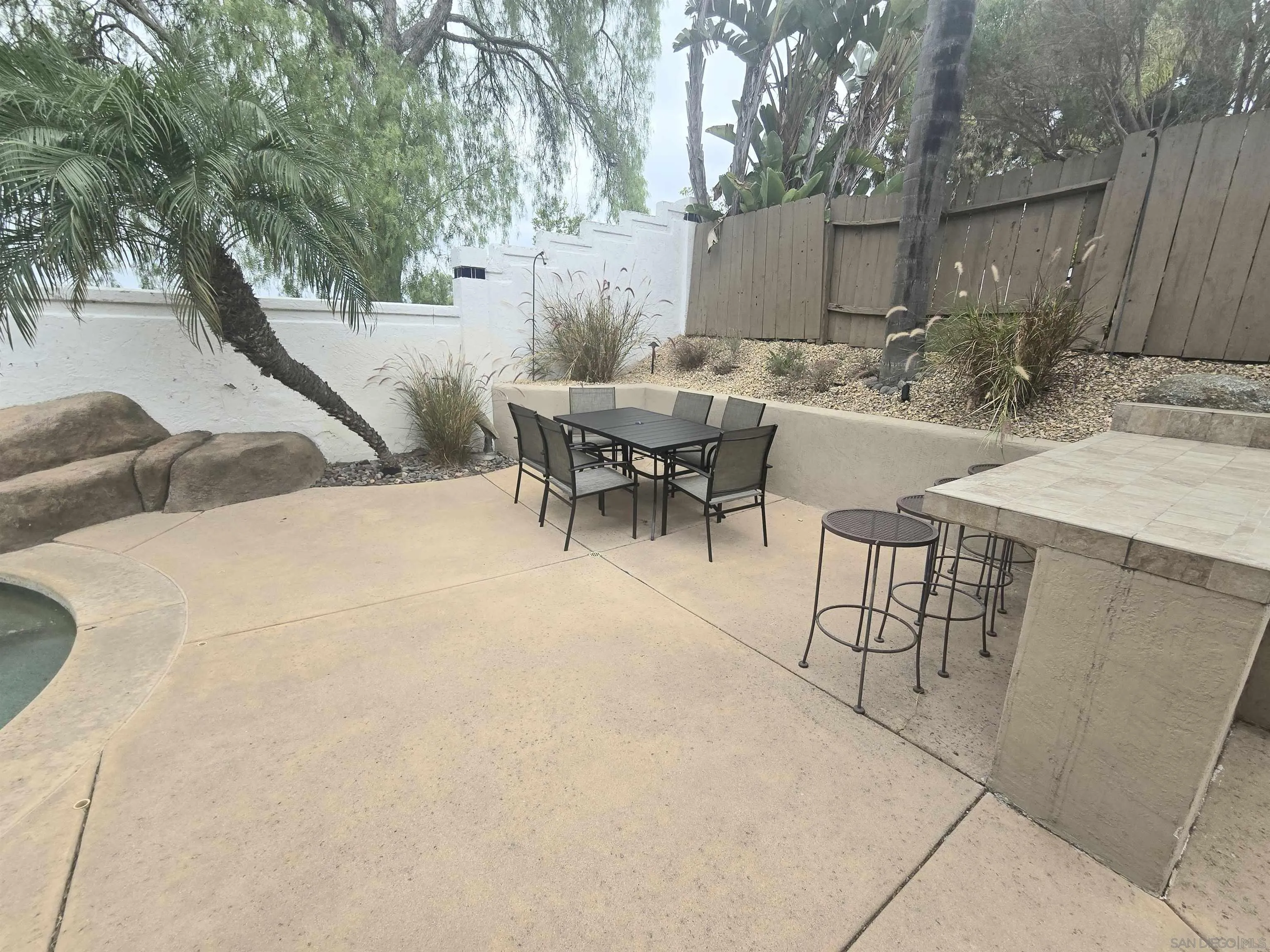 4802 Baroque Terrace Oceanside, CA 92057 - Photo 25 of 26 a view of outdoor dining space with a table and chairs