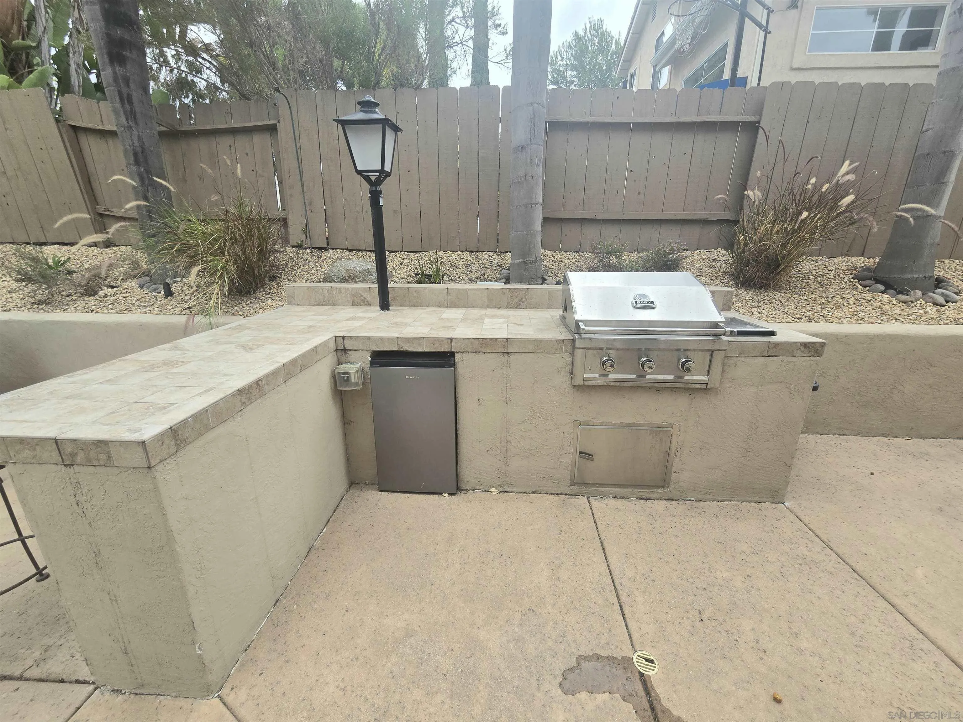 4802 Baroque Terrace Oceanside, CA 92057 - Photo 26 of 26 a bathroom with a sink vanity granite and a mirror
