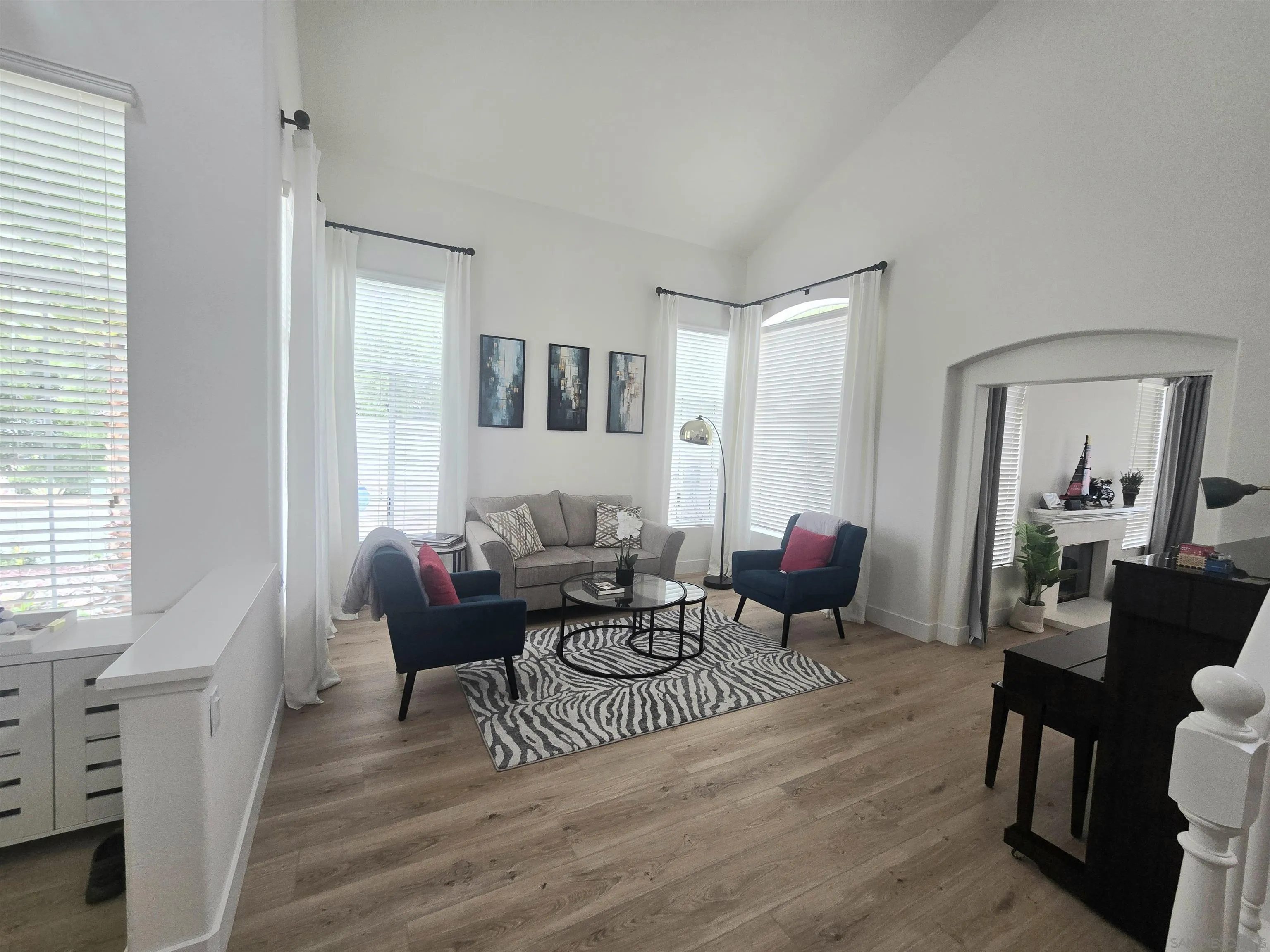 4802 Baroque Terrace Oceanside, CA 92057 - Photo 3 of 26 a living room with furniture and wooden floor