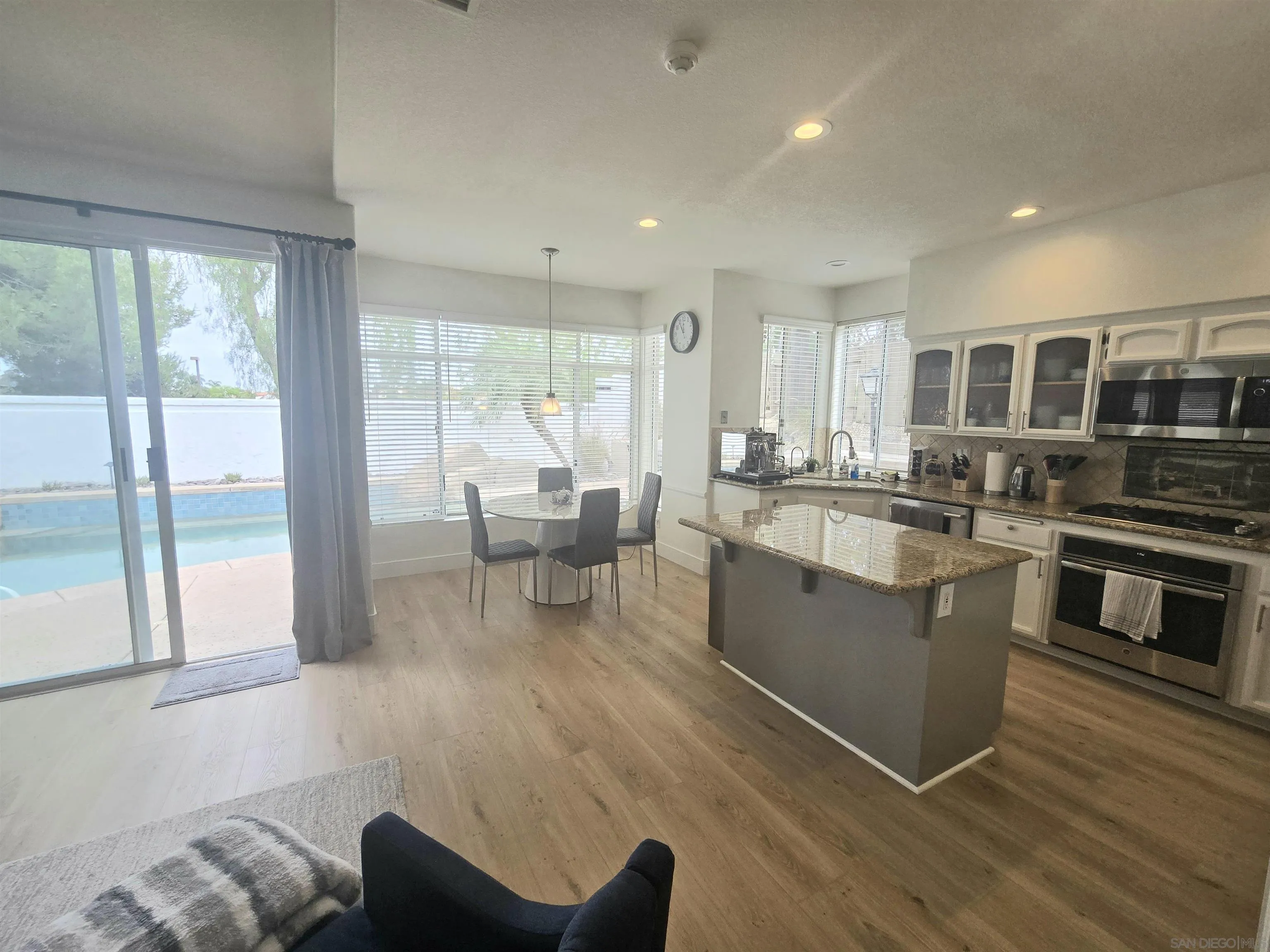 4802 Baroque Terrace Oceanside, CA 92057 - Photo 5 of 26 a kitchen with stainless steel appliances granite countertop a stove and a sink