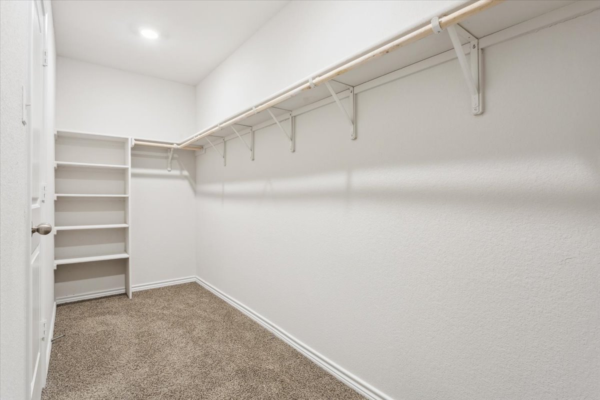5830 Copano Road Belton, TX 76513 - Photo 25 of 34 Walk in closet featuring carpet floors