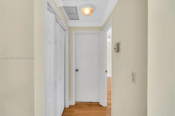 a view of bedroom and bathroom with a sink