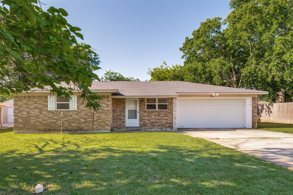 709 East Main Street Pilot Point, TX 76258 - Photo 1 of 11 a front view of house with yard and green space