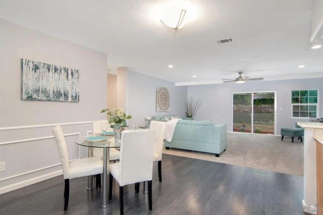 a dining room with furniture and window