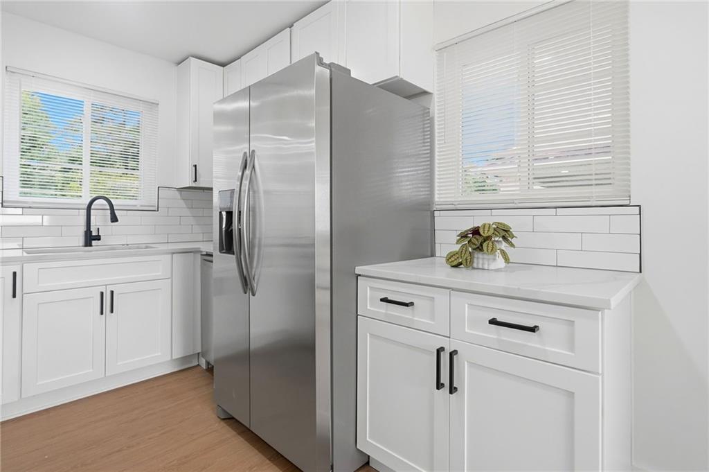 2118 Glendale Drive Decatur, GA 30032 - Photo 11 of 23 a kitchen with stainless steel appliances cabinets and window
