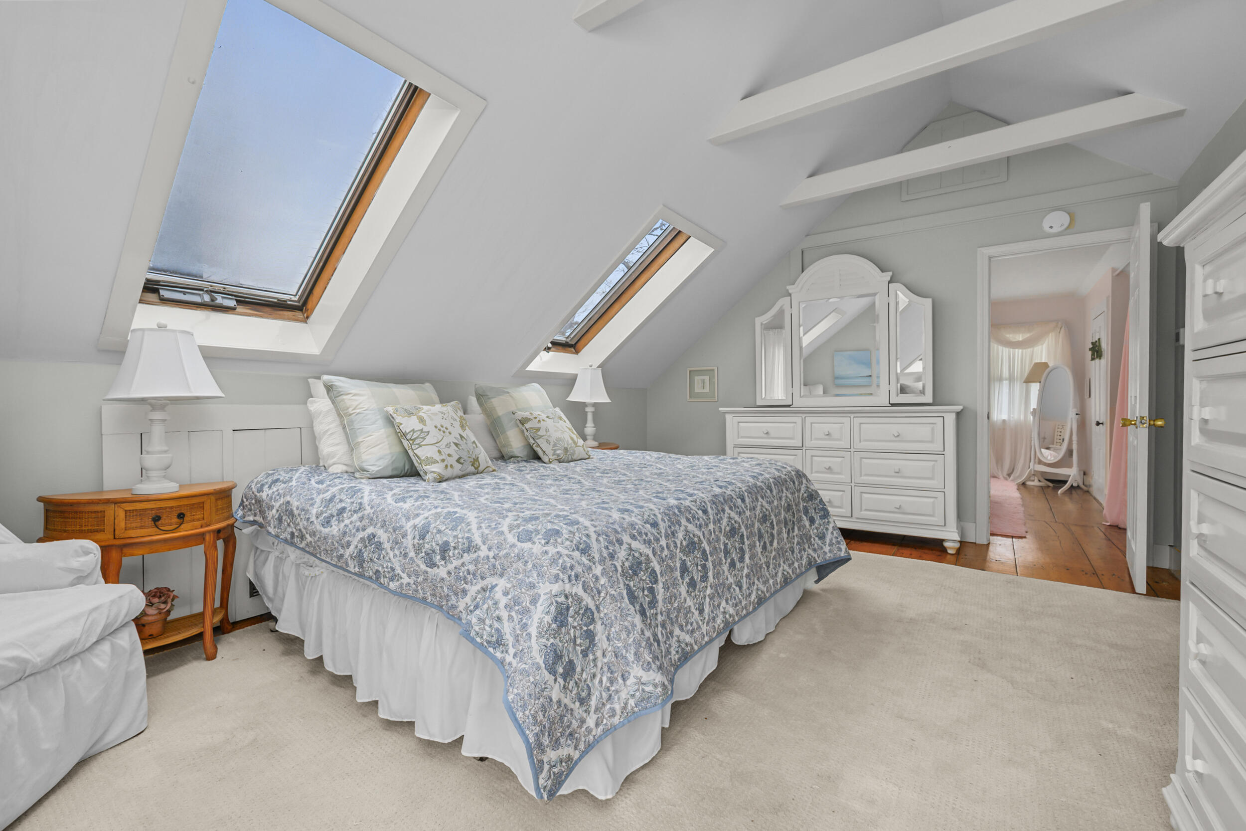332 South Orleans Road Orleans, MA 02653 - Photo 20 of 42 a spacious bedroom with a bed and wooden floor