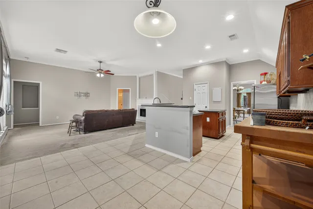 a kitchen with stainless steel appliances furniture stove top oven and cabinets
