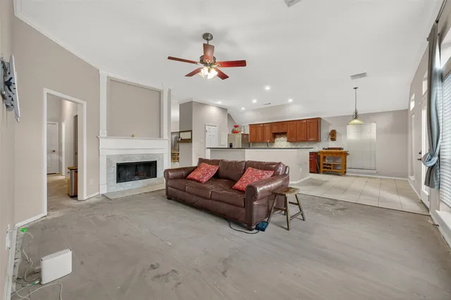 a living room with furniture and a fireplace