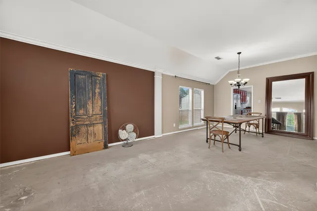a view of a livingroom with furniture and a window