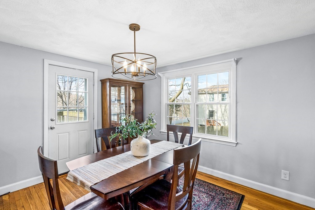 352 West Street Reading, MA 01867 - Photo 14 of 37 a view of a dining room with furniture window and wooden floor
