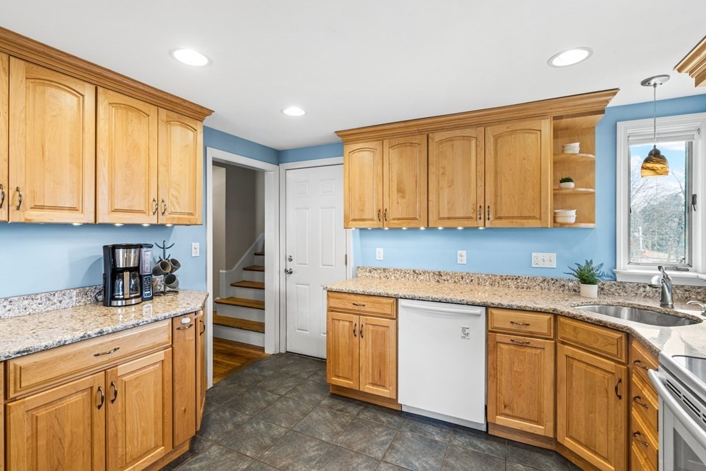 352 West Street Reading, MA 01867 - Photo 18 of 37 a kitchen with a sink stove and cabinets
