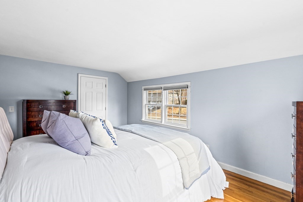 352 West Street Reading, MA 01867 - Photo 25 of 37 a bedroom with a bed and a window