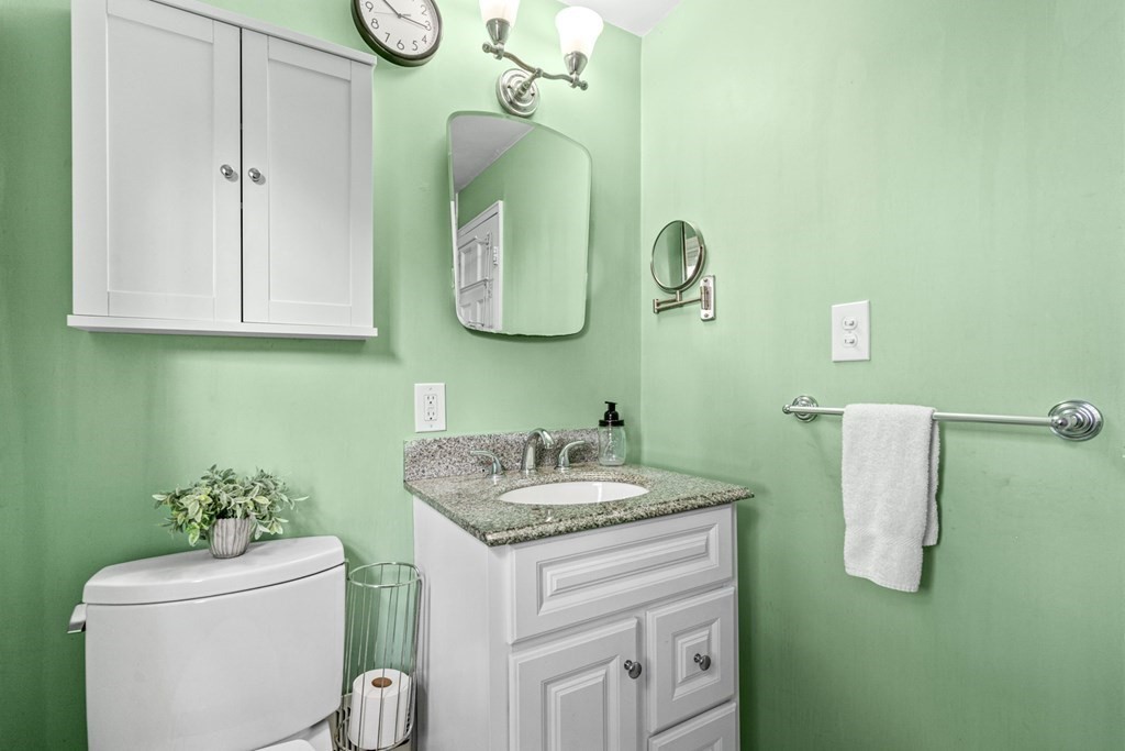 352 West Street Reading, MA 01867 - Photo 26 of 37 a bathroom with a sink and mirror