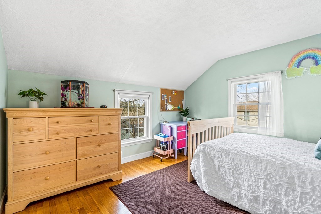 352 West Street Reading, MA 01867 - Photo 30 of 37 a bedroom with a bed and a dresser in it